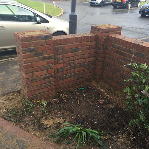 two rectangular shaped piers piers in a brick wall